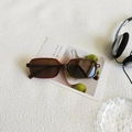 Vintage rectangle sunglasses with dark amber frame shown in a creative lifestyle setting - Tea Frame Tea Lens