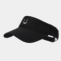 Detail view of the white smiley face embroidery on a black cotton sun visor hat - Black