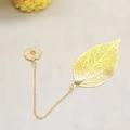 Golden metal leaf bookmark with a white daisy pendant charm on a delicate gold chain - Leaf