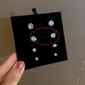 Magnetic zircon stud earrings set in four various sizes on black display card - 7mm (One Pair) / Silver