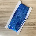 Blue laser glitter fringe curtain for party decoration wrapped on a white cardboard - 1x2m / Laser Blue