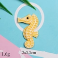 Detail of yellow seahorse resin charm for DIY accessories, size 2x3.3cm, weight 1.6g - Yellow Seahorse