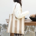 Minimalist khaki striped canvas tote bag with shoulder straps and logo patch - Apricot