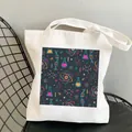 White canvas tote bag with blue chemistry and science print on a black mesh chair - C12 Abstract Science No Inner Pocket No Zipper
