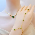 Gold ring-bracelet set featuring elegant green heart-shaped gemstones and crystals - Green Zirconia Heart Style