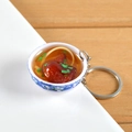 Miniature blue and white porcelain bowl keychain featuring faux braised meat and noodles - Chicken Leg Noodles