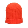 Macro shot of bright orange waffle knit beanie texture and cuffed winter hat edge - One Size / Orange