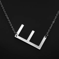 Minimalist silver-tone letter E pendant necklace with delicate chain for women - White Letter E