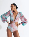Detail view of light blue swimsuit with coral print and deep V-neck lantern sleeves - S / Sky Blue
