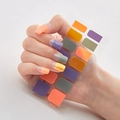 Close-up of multicolor geometric 3D nail stickers DQ-33 shown on model fingertips - DQ-33 Orange Purple Yellow