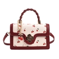 Bolso crema chic con estampado de cerezas, asa tejida y cierre de flor dorada - Burdeos