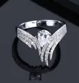 Elegant silver wing ring featuring a pear-cut cubic zirconia and pavé micro-inlay - Ur0581a