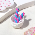 Pink and blue twisted candy clay charms in a small white basket for DIY crafts - Blue & Rose Red