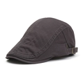 Classica coppola in cotone grigio scuro con fibbia regolabile e cuciture a vista. - Grigio