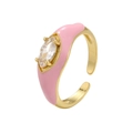 Macro shot of pink enamel ring with marquise-cut cubic zirconia and gold plating - Pink Marquise Style