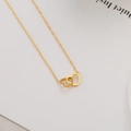 Elegant gold titanium steel necklace featuring minimalist interlocking heart pendants - Interlocking Heart Rings
