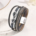 Detail of bohemian multilayer leather bracelet with rhinestones and silver infinity charm - Gray