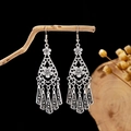 Detail of vintage bohemian hollow earrings with silver tassels on a natural branch - E2875-44/Flower Bar Tassel