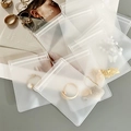 Frosted EVA jewelry storage bags for earrings and rings shown on minimalist background - Frosted EVA (15*15CM)