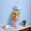 Artificial sunflower and blue dried flower bouquet in a transparent gift bag with peach wrap - Sunflower Gypsophila Gift Bag Greeting Card