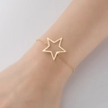 Minimalist gold hollow star bracelet made of stainless steel on female wrist - 350-Hollow Star