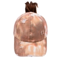 Detail of distressed tie-dye ponytail baseball cap with a hole for high messy buns - Rust and White Tie-dye