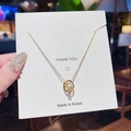 Elegant gold double ring necklace with sparkling crystals on a minimalist chain - X030 Double Ring Zirconia Necklace / Gold