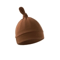 Detail of soft brown knitted newborn hat with a stylish top knot on white background - Caramel color