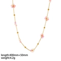 Macro shot of 18K gold plated flower necklace with pink and purple beads, length 40cm+5cm - Necklace / Pink