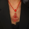 Close-up of vintage gold necklace with red teardrop rhinestones on black blazer - Red Water Drop Pendant Necklace (S247)
