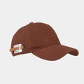 Detail of the brown baseball cap side featuring a fabric label and leather strap with rivet - Tan
