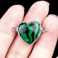 Green malachite heart connector with silver bezel held by hand on black background - Synthetic Malachite Double Hole (Silver)