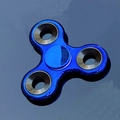 Blue electroplated metal fidget spinner with three blades and dark weights on reflective surface - Electroplated Blue with Iron Weight