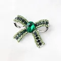 Elegant bow brooch with green rhinestones and emerald-colored crystal for suit accessory - Green