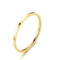 Close-up of minimalist thin gold titanium steel band ring with polished smooth surface - US 5 / 2MM Flat Style / Gold