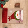 Linen Christmas drawstring gift bag featuring a snowman pattern with a festive red scarf - Snowman / Small 35*25cm