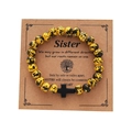 Unisex yellow and black bead bracelet with a black cross charm on a sister gift card - Yellow Black Spotted Black Cross Card Bracelet