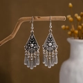 Detail of vintage silver bohemian tassel earrings hanging on a natural wooden branch - E2874-37/Geometric Rhombus Tassel