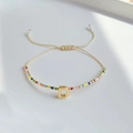 Boho-Armband aus Miyuki-Perlen mit goldenem Buchstaben-D und verstellbarer beige Schnur - Buchstabe D