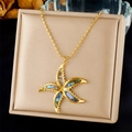 Close-up of gold starfish pendant with colorful abalone shell on a beaded chain - Starfish Inlaid With Colorful Abalone Shell (N3487)