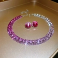 Close-up of sparkling pink gradient crystal necklace and stud earrings jewelry set - Purple Rabbit Set
