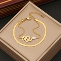 Detail of a double-layered gold snake bracelet with rhinestone charms on jewelry box - Snake Head with White Rhinestone Accents Style (5#)
