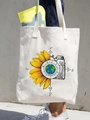 Off-white canvas tote bag featuring sunflower, camera, and compass wanderer print - WANDERER Compass