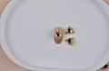 3Pcs heart-shaped dark gemstone nail charms with rhinestones on pink nail tip - Gold Frame Heart Dark Gemstone