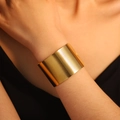 Elegant wide gold stainless steel leaf cuff bracelet featuring stylish horizontal ridges - Horizontal Stripes