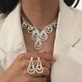 Silver bridal jewelry set with flower pattern necklace and earrings on female model - DTN14026941S-Silver Chandelier Pave