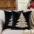 Two black velvet Christmas pillows with gold and silver tree embroidery on white sofa - Black Christmas Tree/Black