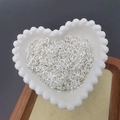 Silver open jump rings for jewelry making displayed in a heart-shaped ceramic dish - 0.6*4mm / Silver