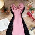 Pink satin slip dress with black lace trim elegantly displayed on wooden floor - S / Pink