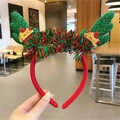 Christmas headband with red fabric, green glitter reindeer antlers and a small gold crown - Green Winged Antler Headband